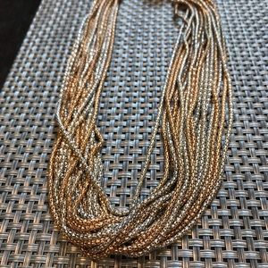 Layered silver and gold necklace